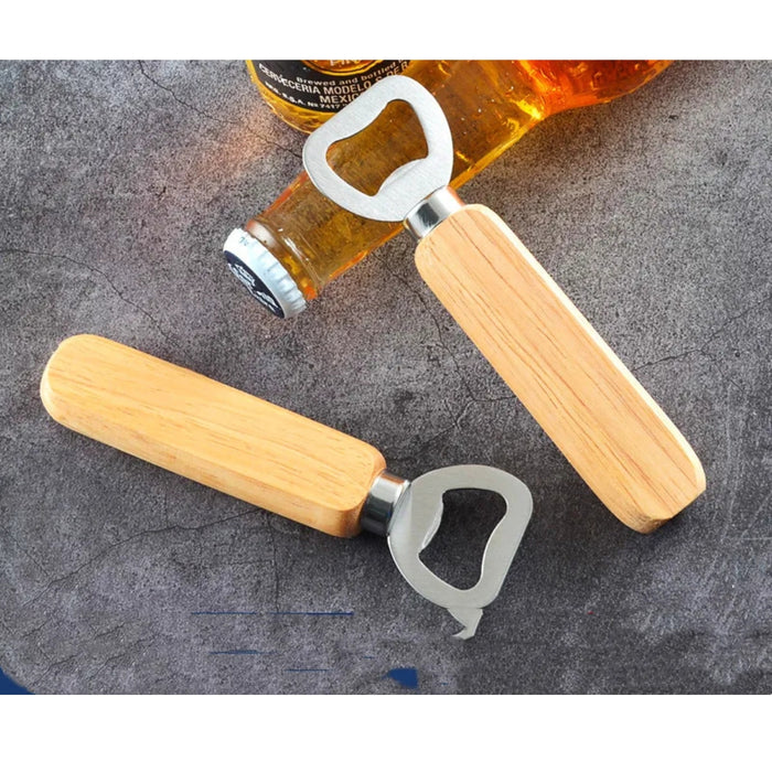 Two wooden bottle openers on a textured surface with a bottle in the background.