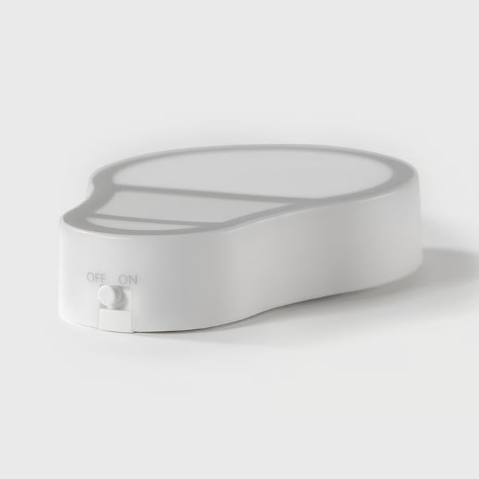 White, flat nightlight shaped like a bulb with an ON/OFF switch on the side, designed with a modern minimalistic style for contemporary home décor.