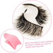 False eyelashes with a pink tool on a white background