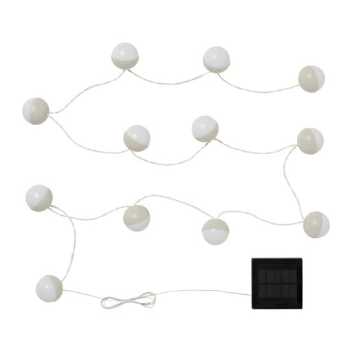 String of white spherical lights with a solar panel on a white background