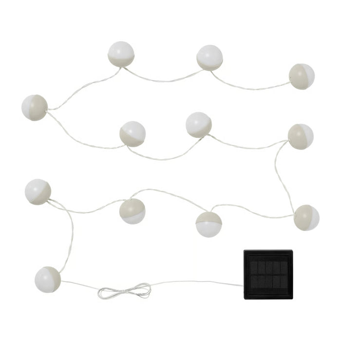 String of white spherical lights with a solar panel on a white background