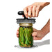Handheld vacuum jar sealer shown preserving green beans and spices – black handle and gray sealing head for airtight closure – 1600004084340 13927404