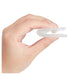 Hand holding a small white silicone product against a white background