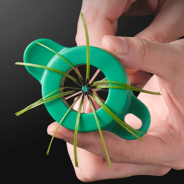 Green handheld herb stripper shown pulling rosemary stem through blade holes – efficiently separates leaves for cooking prep – 1598451114240 13941221