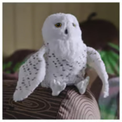 IKEA SKOGSDUVA soft toy – snowy owl plush with yellow eyes and speckled wings, perched on striped fabric surface - 50576896

