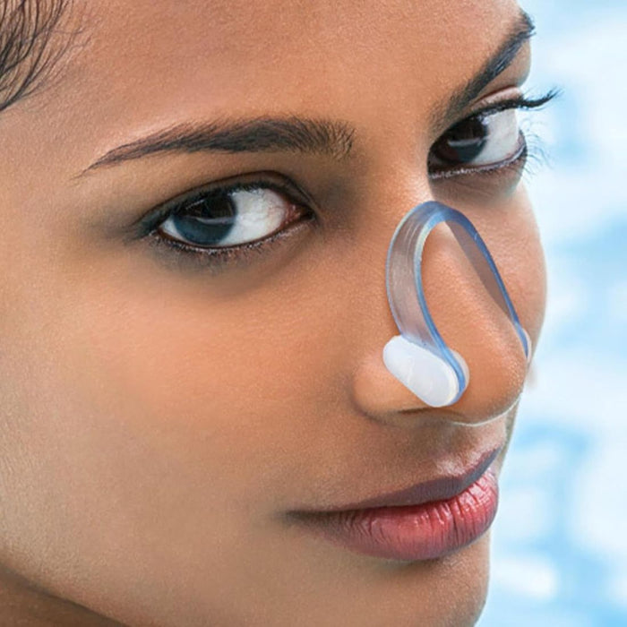 Close-up of transparent blue nasal device worn on nose, highlighting airflow support - 