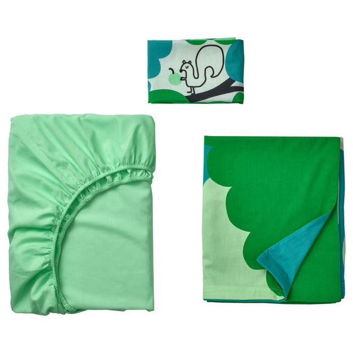 Green fitted sheet and green blanket with blue corner on a white background