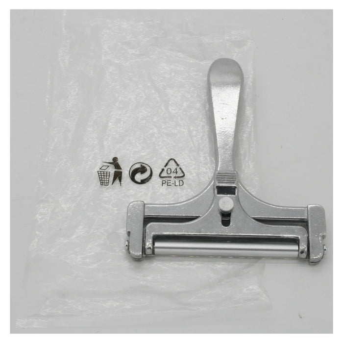 Metal clip on a textured gray background with recycling symbols.