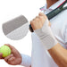 Wrist support brace white worn during tennis game with breathable fabric close-up