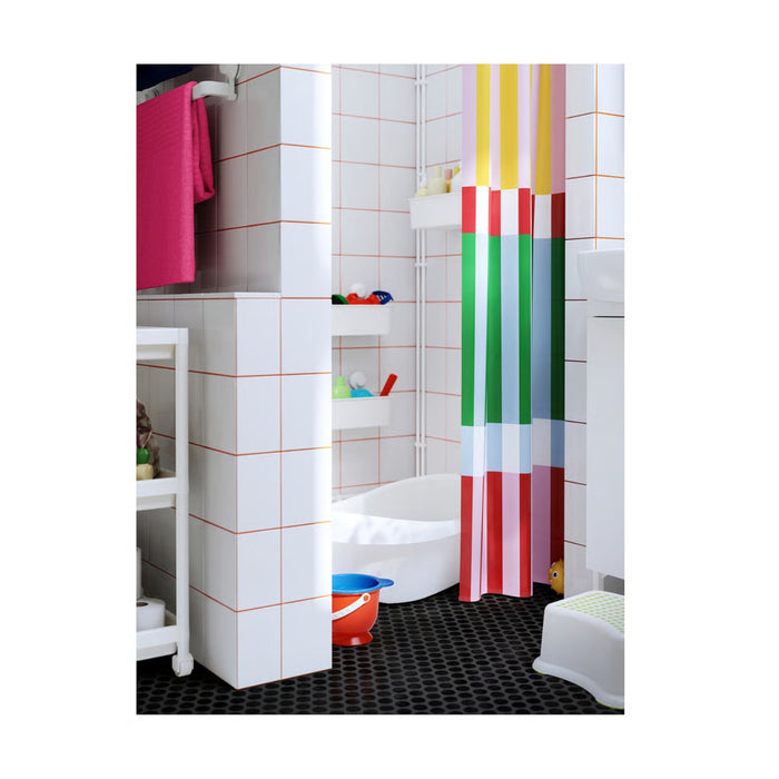 Bathroom with a colorful striped shower curtain and various items on shelves.