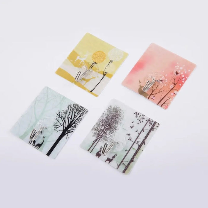 Four square cards with nature-themed designs on a white background