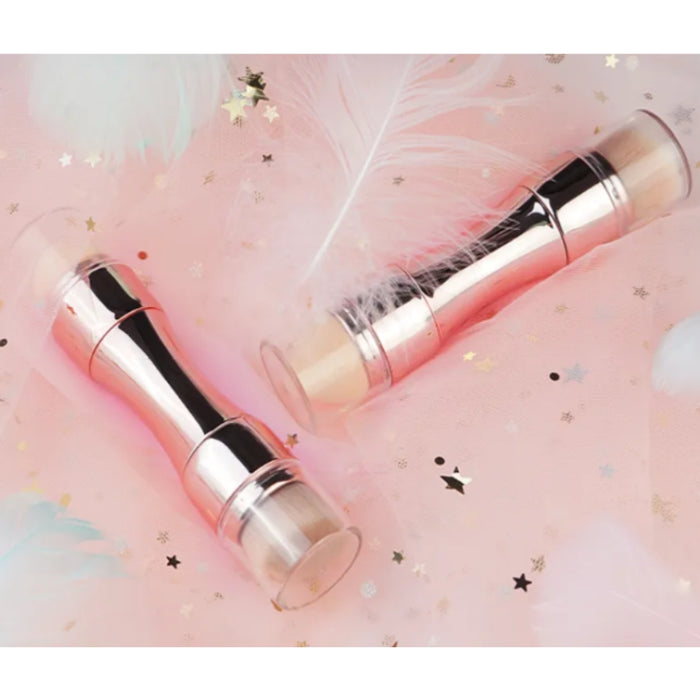 Two silver cylindrical objects on a pink background with star and cloud decorations