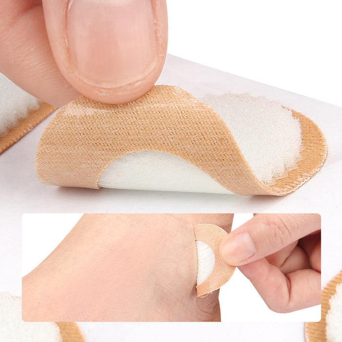 Digital Shoppy circular adhesive pad peeled from backing and applied to heel of foot