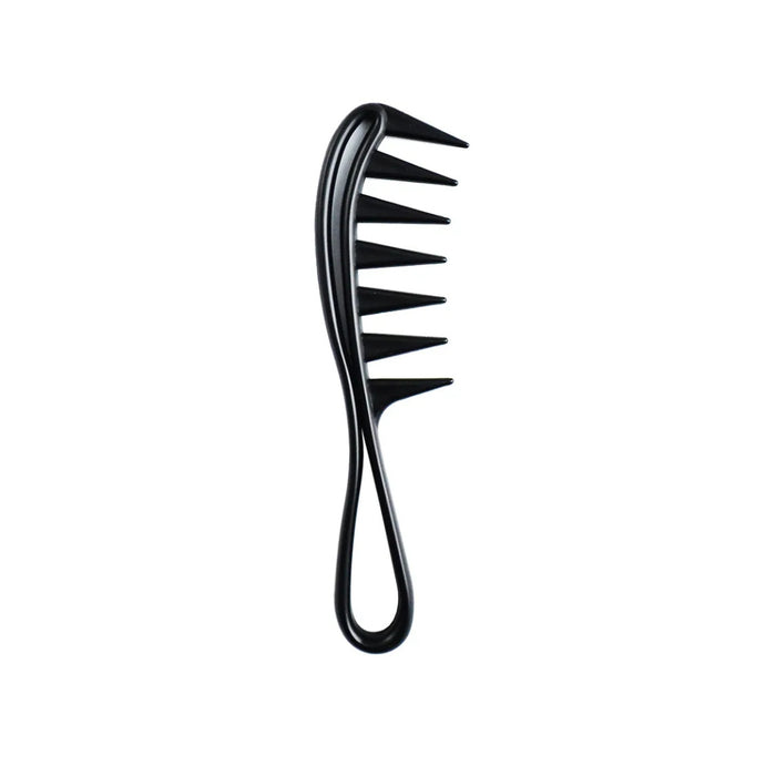Wide tooth comb detangling curly hair gently