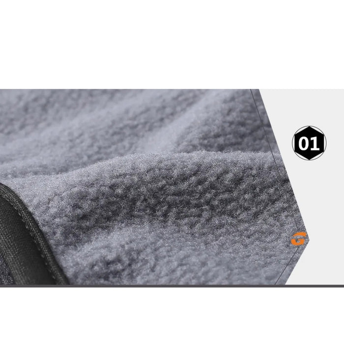 Close-up of gray textured fabric with a brand logo on a white background