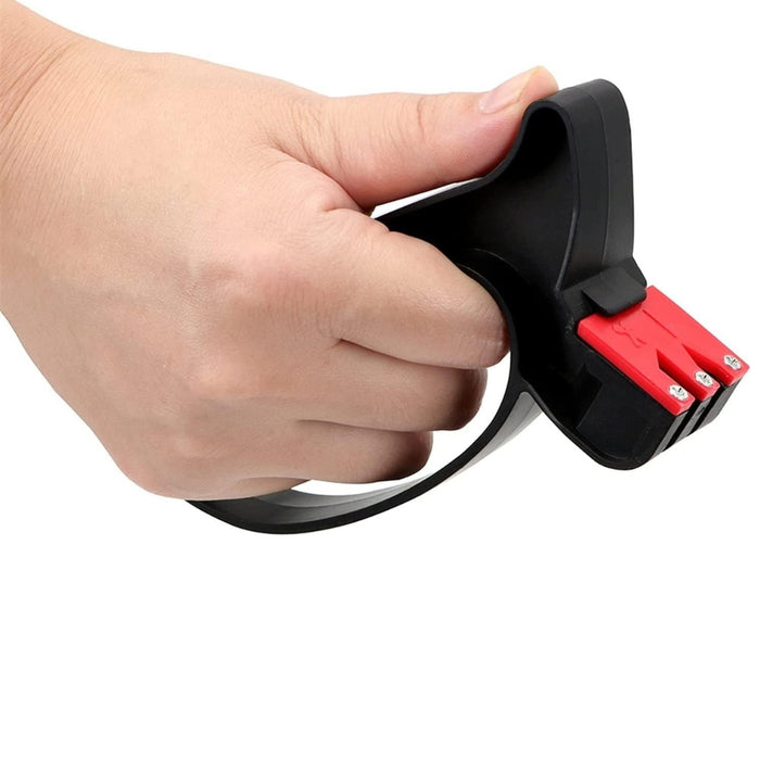 2-in-1 Knife & Scissor Sharpener – Handheld, ergonomic grip, black device held in hand with blade inserted - 