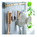 Set of kitchen utensils hanging on a rack with a blurred background