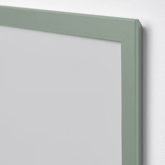 Close-up of IKEA FISKBO frame in light grey-green, 21x30 cm (8 ¼x11 ¾"); smooth matte finish with clean corner detailing – mounted on white wall, ideal for minimalist photo or art display - 10584916