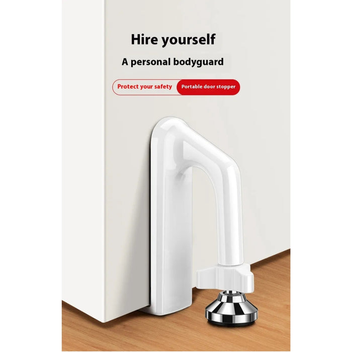 Anti-theft door stopper—white top with metallic base and black grip pad, wedged under a door; promotional text reads “Hire yourself a personal bodyguard – Protect your safety Portable door stopper” with locking arrows for added security indication – 1600003772922 13245865.