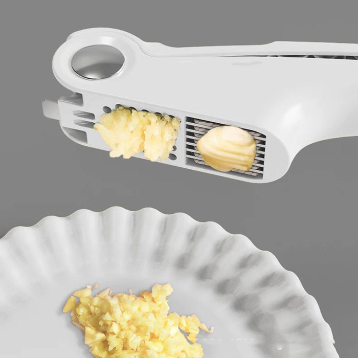 Digital Shoppy White garlic press in use, extruding minced garlic onto fluted paper plate