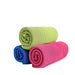 Three rolled-up cooling towels in green, blue, and pink on a white background