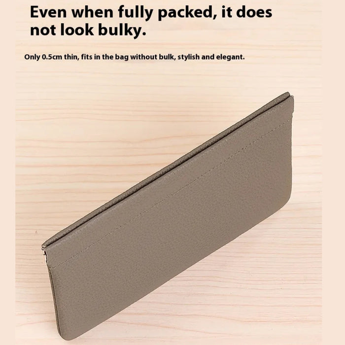 Gray cowhide leather wallet – hand pinching soft textured pouch to show flexibility and tactile quality