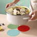 multi‑colour silicone mats stacked together for kitchen use
