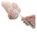 Hand holding a light blue toothbrush near a child's foot on a white background