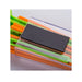 Stack of colorful plastic straws with a black rectangular object on top