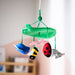 SANDBI mobile hanging in nursery with green leaf top and five plush figures: bird, flower, bee, ladybug, and mouse