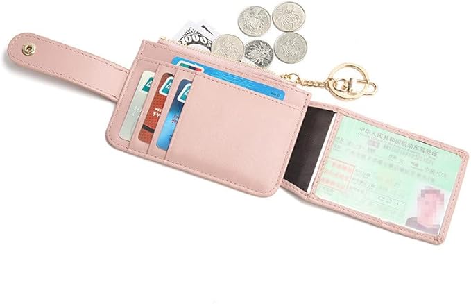 Pink wallet with card slots, coins, and a keychain on a white background