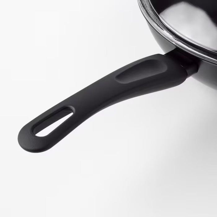 Close-up of the wok's lid and ergonomic handles, providing versatility and control in your cooking.