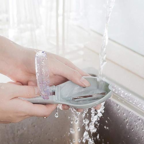 Digital Shoppy Person rinsing translucent purple fish scaler under running water in kitchen sink
