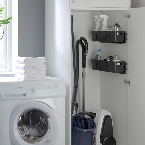 Laundry room with washing machine, cleaning supplies, and a cabinet.