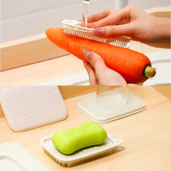 Person scrubbing a carrot with a brush on a wooden surface, next to a bar of soap.