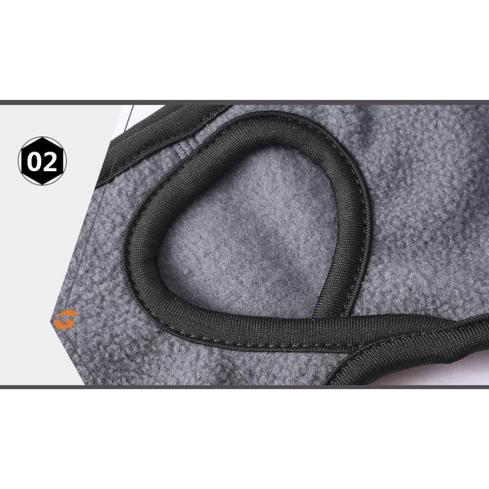 Gray dog muzzle with black strap on a white background
