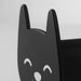 A black cat-shaped wall hook with pointed ears and closed eyes, mounted on a light-colored wall. Minimalist, decorative, and functional storage for accessories or clothing.-90567791
