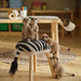 Two IKEA SANDLÖPARE covers with gathered edges and bold stripes, placed on light wooden stools in cozy indoor setting