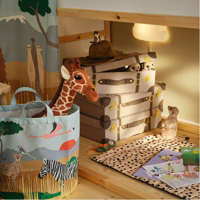 Children's room with toy storage bins, a stuffed giraffe, and a tote bag with animal designs.