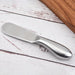 Digital Shoppy Multi-functional Cheese Knife, serrated edge butter knife with smooth handle on rustic white surface