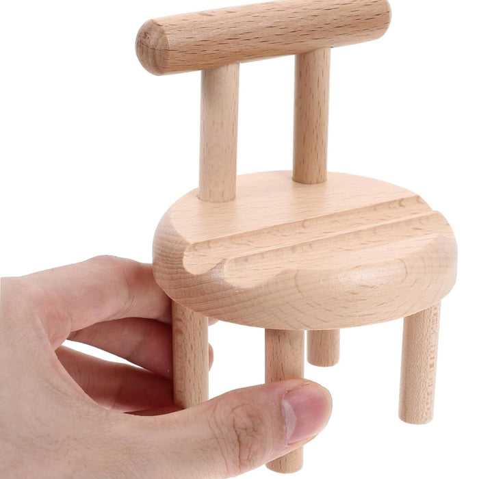 Mini wooden chair mobile holder shown in hand for scale – round seat with carved grooves and smooth finish – 1598453326009 13953547