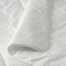 Close-up of IKEA STJÄRNBRÄCKA warm white duvet, 150x200 cm, showing quilted stitching and folded corner to highlight thickness and soft texture – 00458089