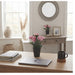 IKEA FEJKA artificial plant in home office setup with laptop and mug