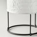 Close-up of IKEA STRANDAD table lamp with white crinkled paper shade and black metal frame; cylindrical design with three vertical rods and round base – 20594849