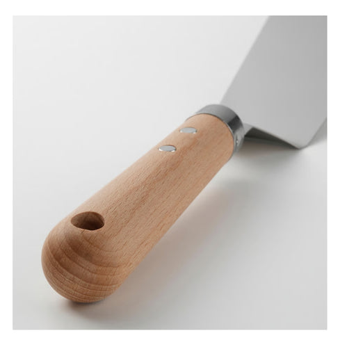 Metal spatula with wooden handle on a white background