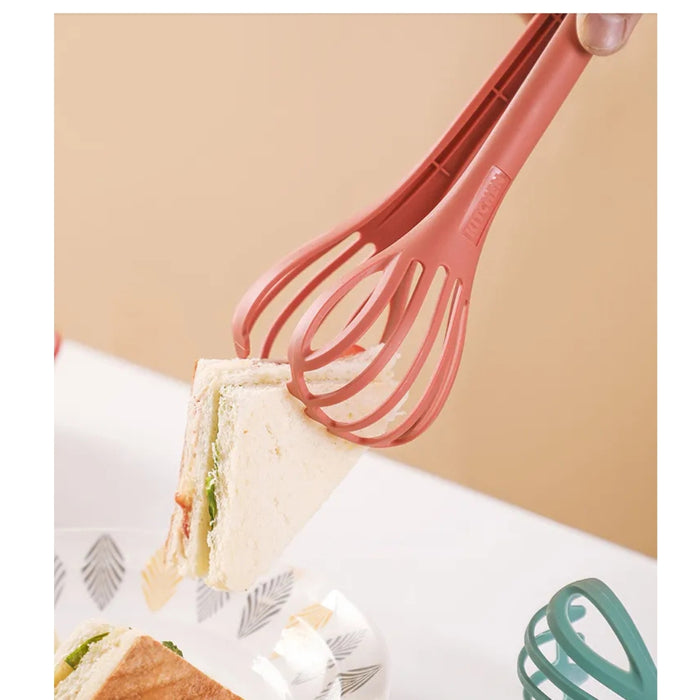 Cage-style tongs gently gripping a sandwich, demonstrating soft-grip design for serving delicate foods