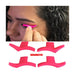 Pink eyelash extension tool being used on a person's eye with additional tools displayed below.