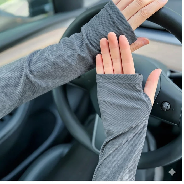 Close-up of hands in textured gray sleeves with thumb loops, designed for extended wear and UV shielding