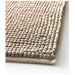 Close-up of TOFTBO mat’s plush tufts on smooth surface, emphasizing softness and absorbency