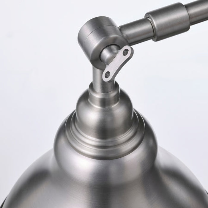 Close-up of ANKARSPEL joint and brushed metal shade showing industrial detailing and pivot mechanism